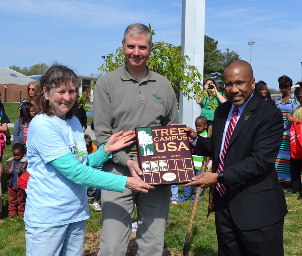 From left, Dr. Susan Yost, State Forester Mike Valenti, and Delaware State University President Harry L. Williams celebrate DSU's certification as a Tree Campus USA by the National Arbor Day Foundation. In addition to being the only Tree Campus USA in the First State, DSU is currently the only historically Black college or university (HCBU) to be recognized in the United States.