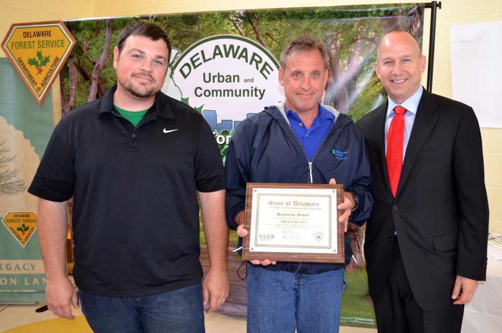 Michael Krzyzanowski, Delmarva Power's  Vegetation Management Newcastle Region and Michael Casmay, Staff Forester, accept their Tree Line USA award from Governor Markell. 
