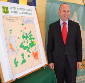 Governor Markell looks at a map showing where 370 acres of foresltna in Sussex County will be added to Redden State Forest.