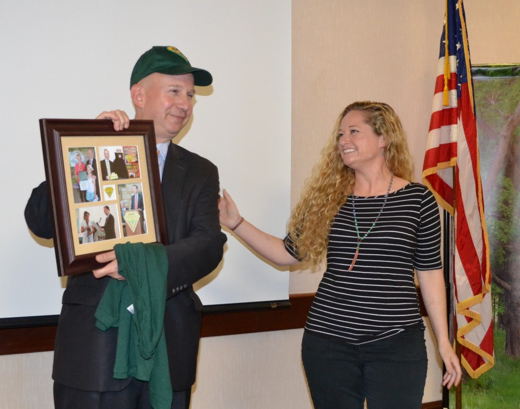 Governor Markell receives a commemorative photo frame from Delaware Forest Service education specialist Ashley Peebles.