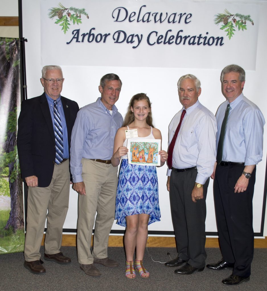 Delaware 2018 Arbor Day poster contest winner Amelia Meyer and Gov. Carney with state officials